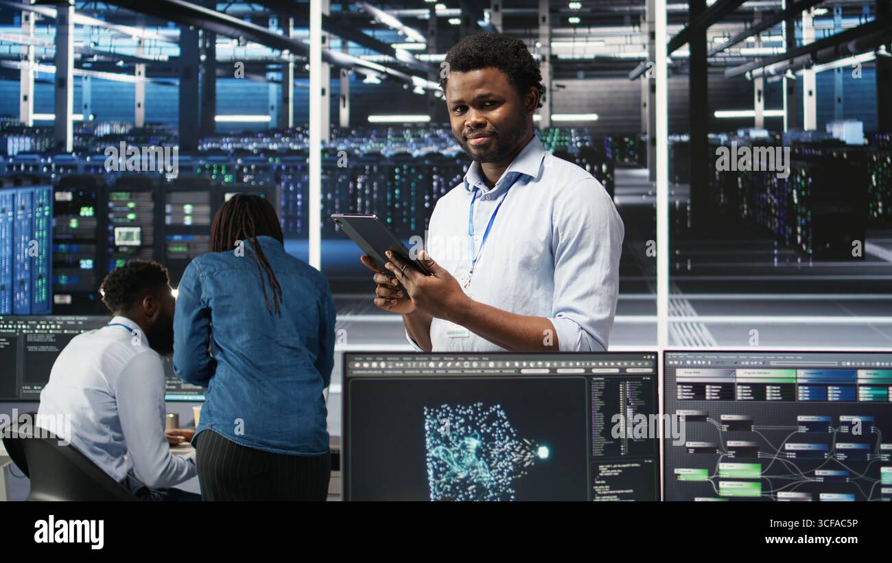 Data center technician uses node tree programming interface to identify equipment performance issues. Engineer reviews data analysis graph in server hub to minimize hardware failures, camera A Stock Photo