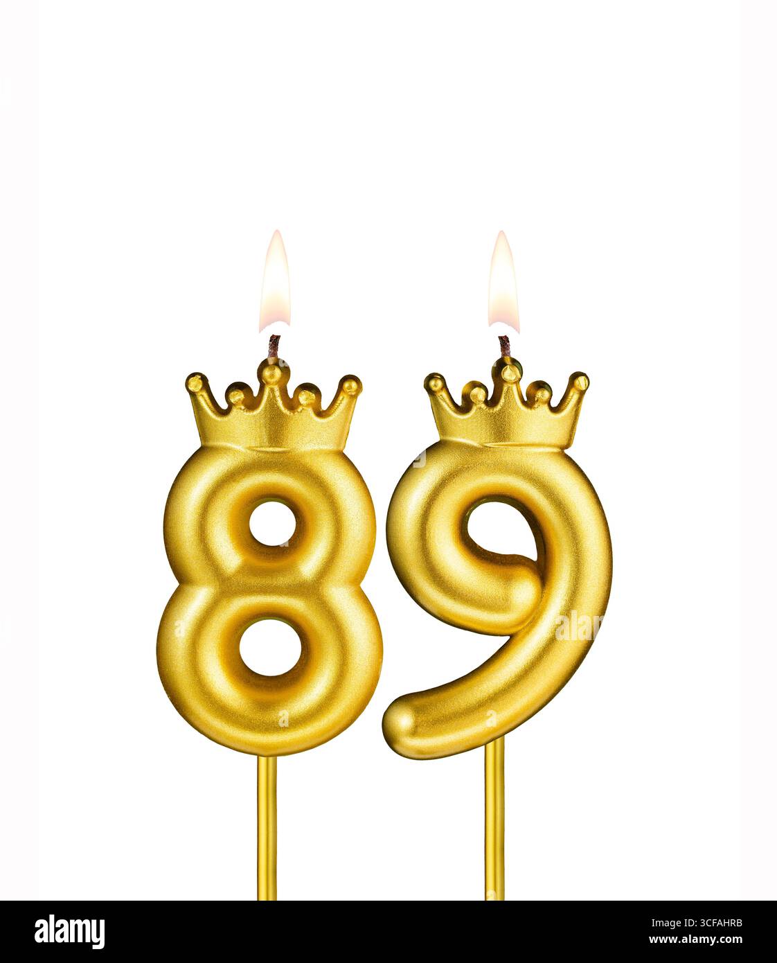 Golden number 89 birthday candle on white background Stock Photo
