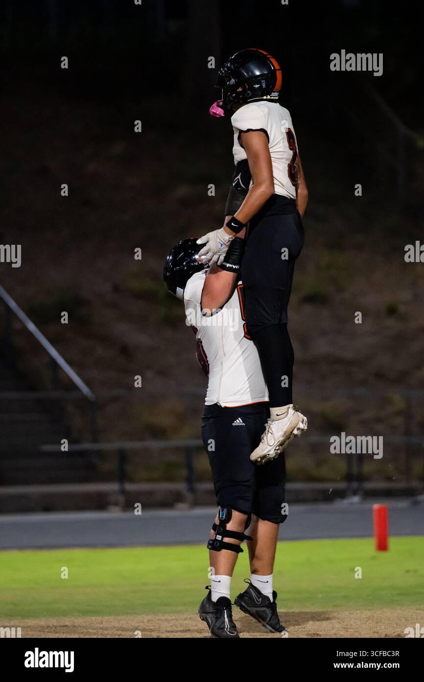 American Football Game Moanalua vs Campbell. Played at night on natural grass field. Rivalry season opener. Stock Photo