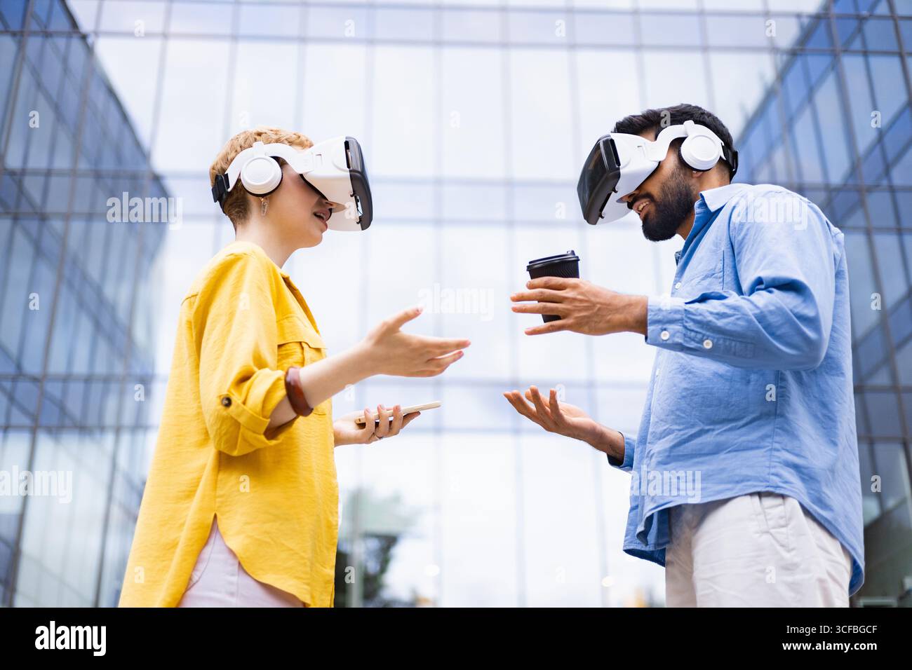People Using VR Headsets Outdoors Stock Photo