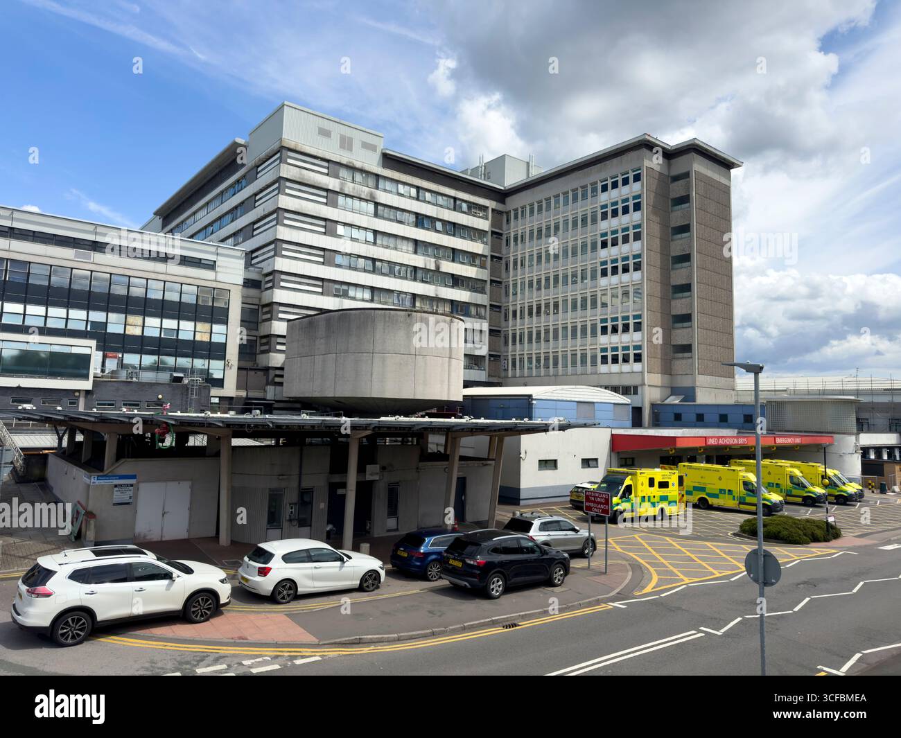 Emergency Unit entrance with ambulances parked outside University Hospital of Wales, Cardiff: Phillip Roberts - Smartphone Captured Stock Image
