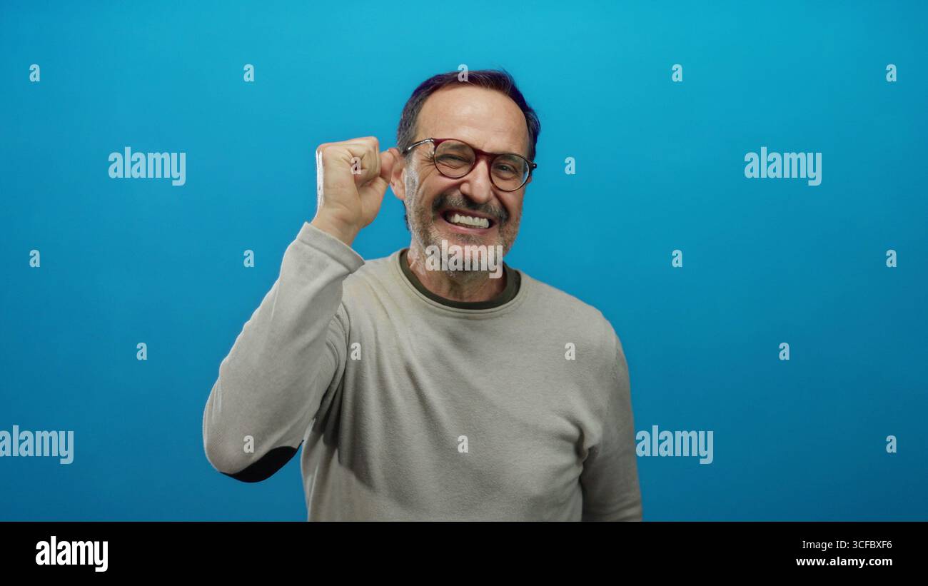 Mature hispanic man expressing joy hi-res stock photography and images