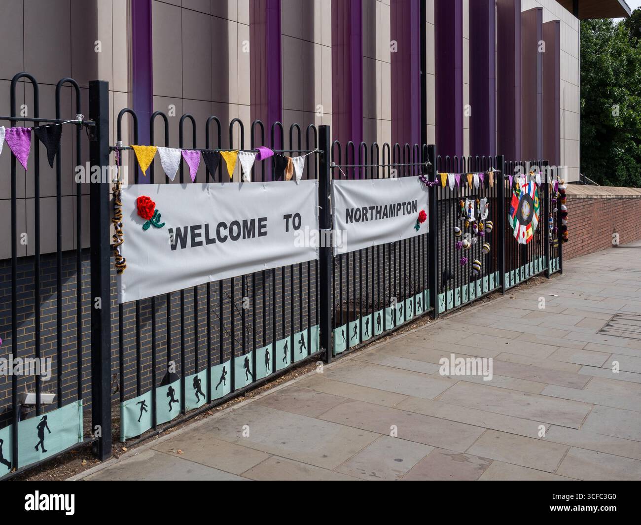 Knitted decorations prepared by local groups to celebrate the Women's Rugby World Cup 2025 outside the Railway Station, Northampton, UK Stock Photo