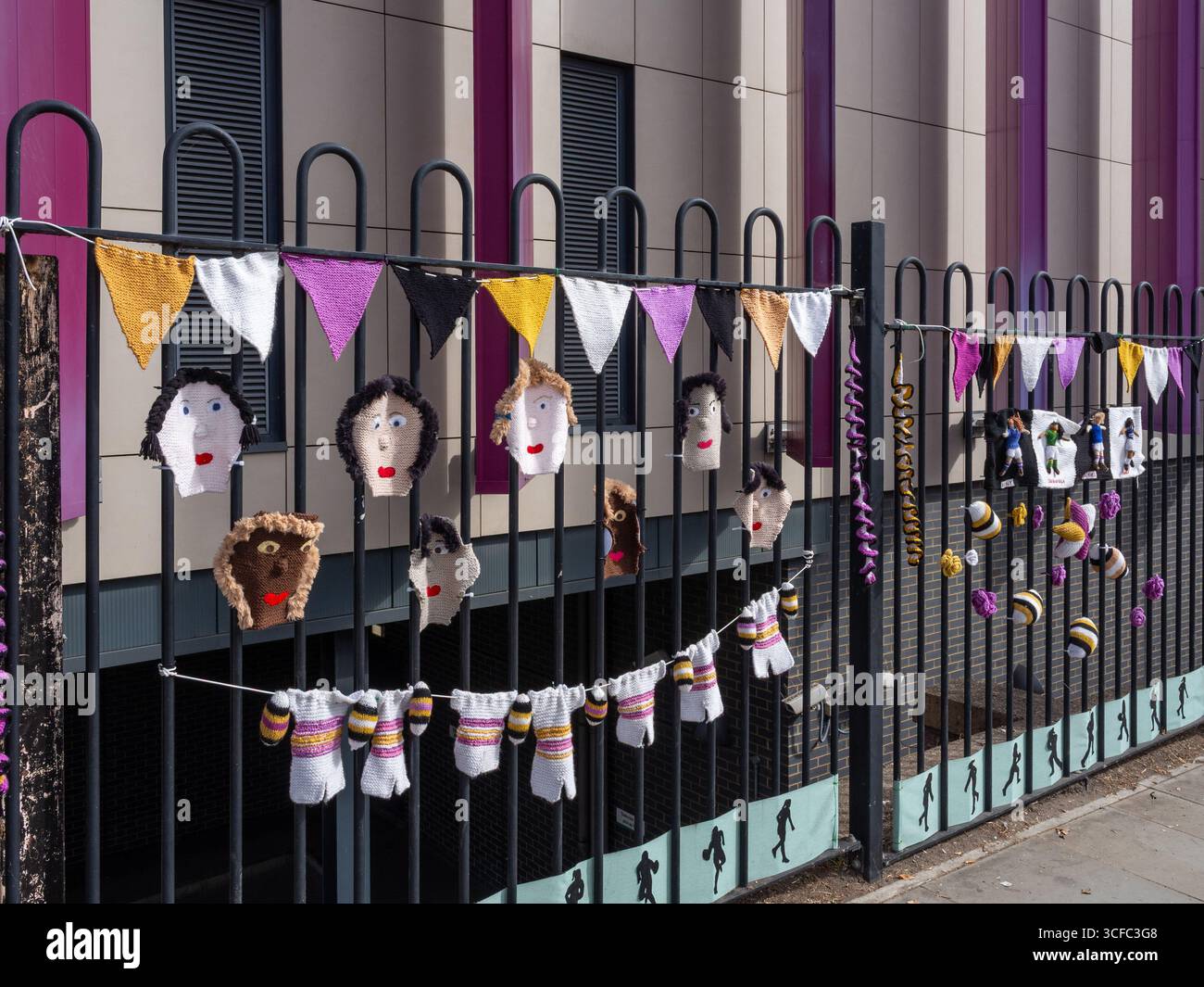 Knitted decorations prepared by local groups to celebrate the Women's Rugby World Cup 2025 outside the Railway Station, Northampton, UK Stock Photo