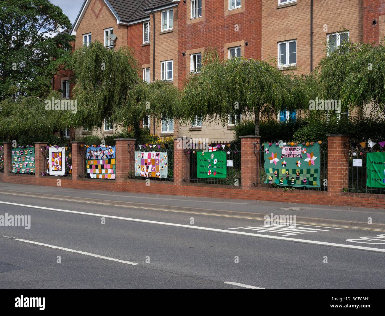 Knitted decorations prepared by local groups to celebrate the Women's Rugby World Cup 2025 lining the road to Franklins Gardens, Northampton, UK Stock Photo
