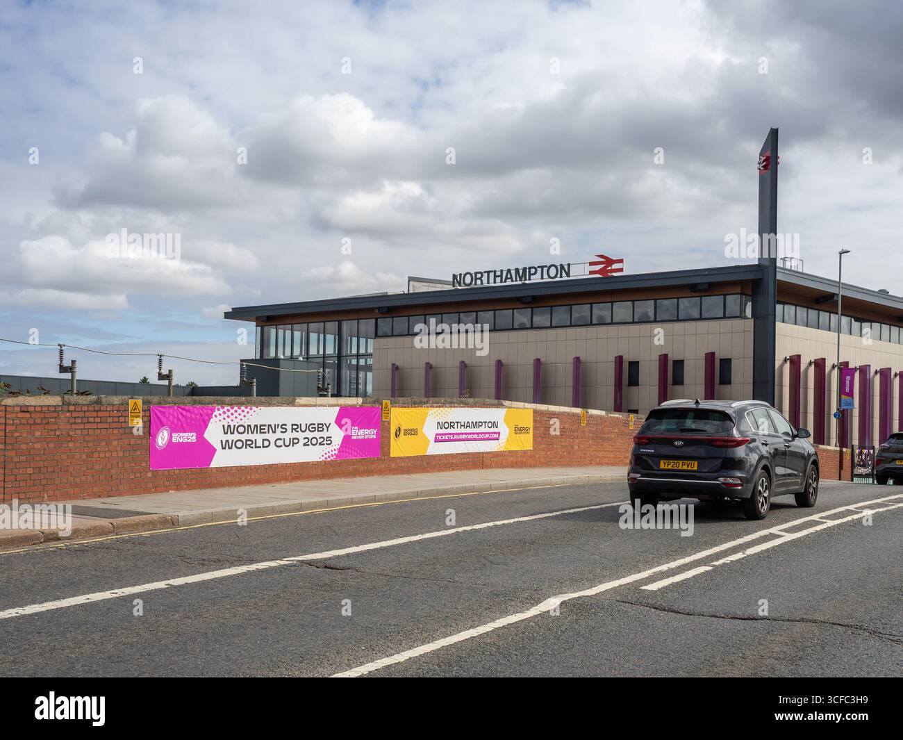 Northampton Railway Station viewed from Westbridge, with posters for the Women's Rugby World Cup 2025 in the foreground, Northampton, UK Stock Photo