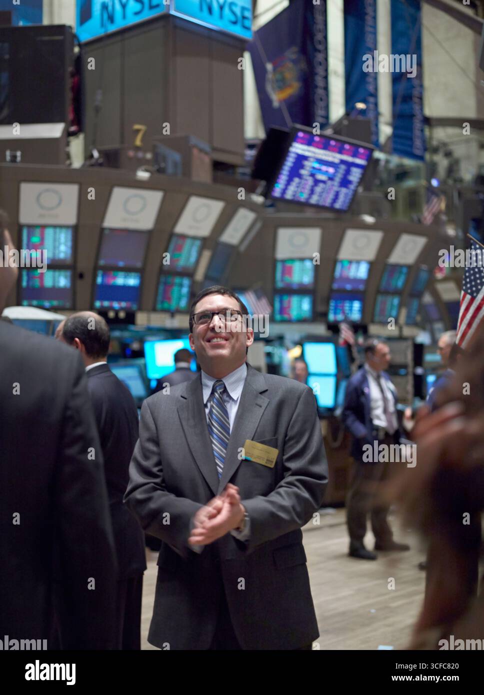 A happy businessman on the floor of the New York Stock Exchange Stock Photo