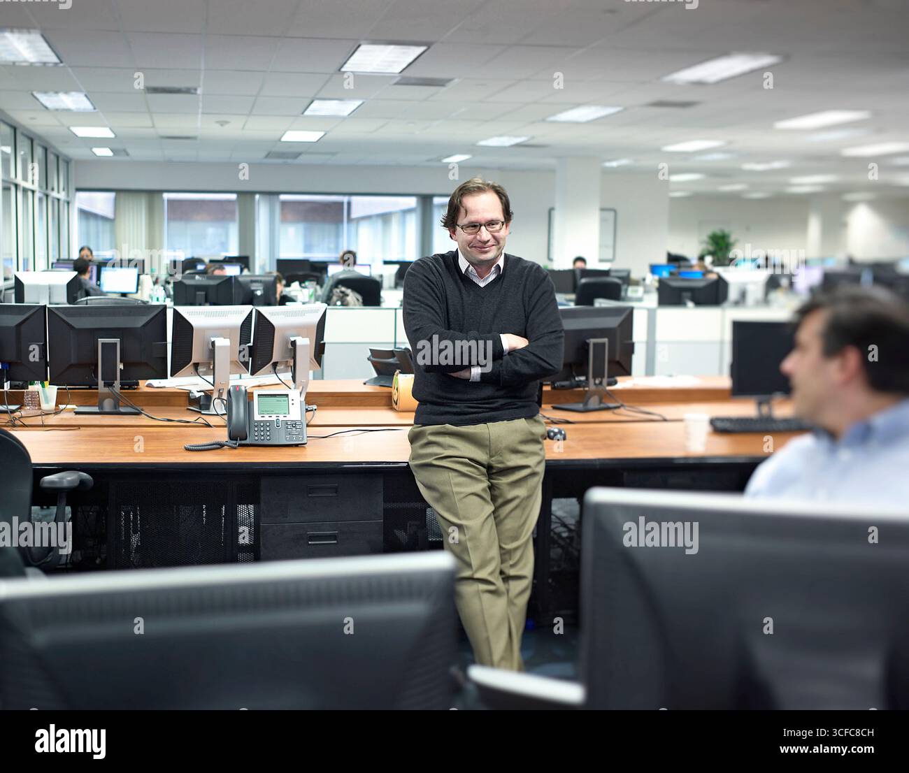 Three traders having a discussion in an office. Stock Photo