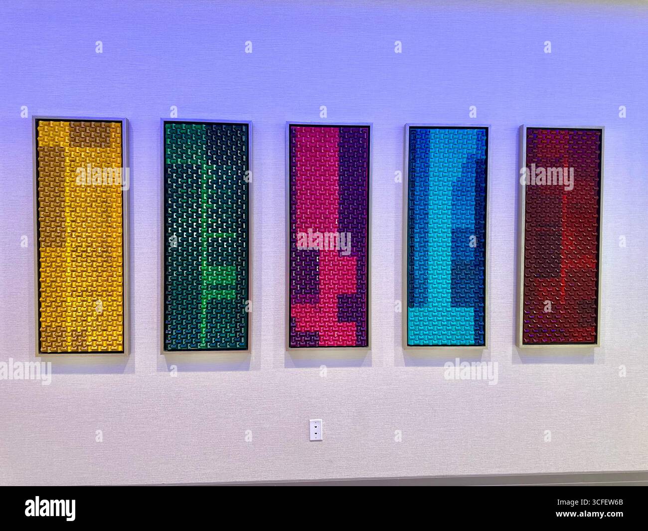 Modern abstract wall art panels with geometric textured patterns in vibrant colors - Smartphone Captured Stock Image