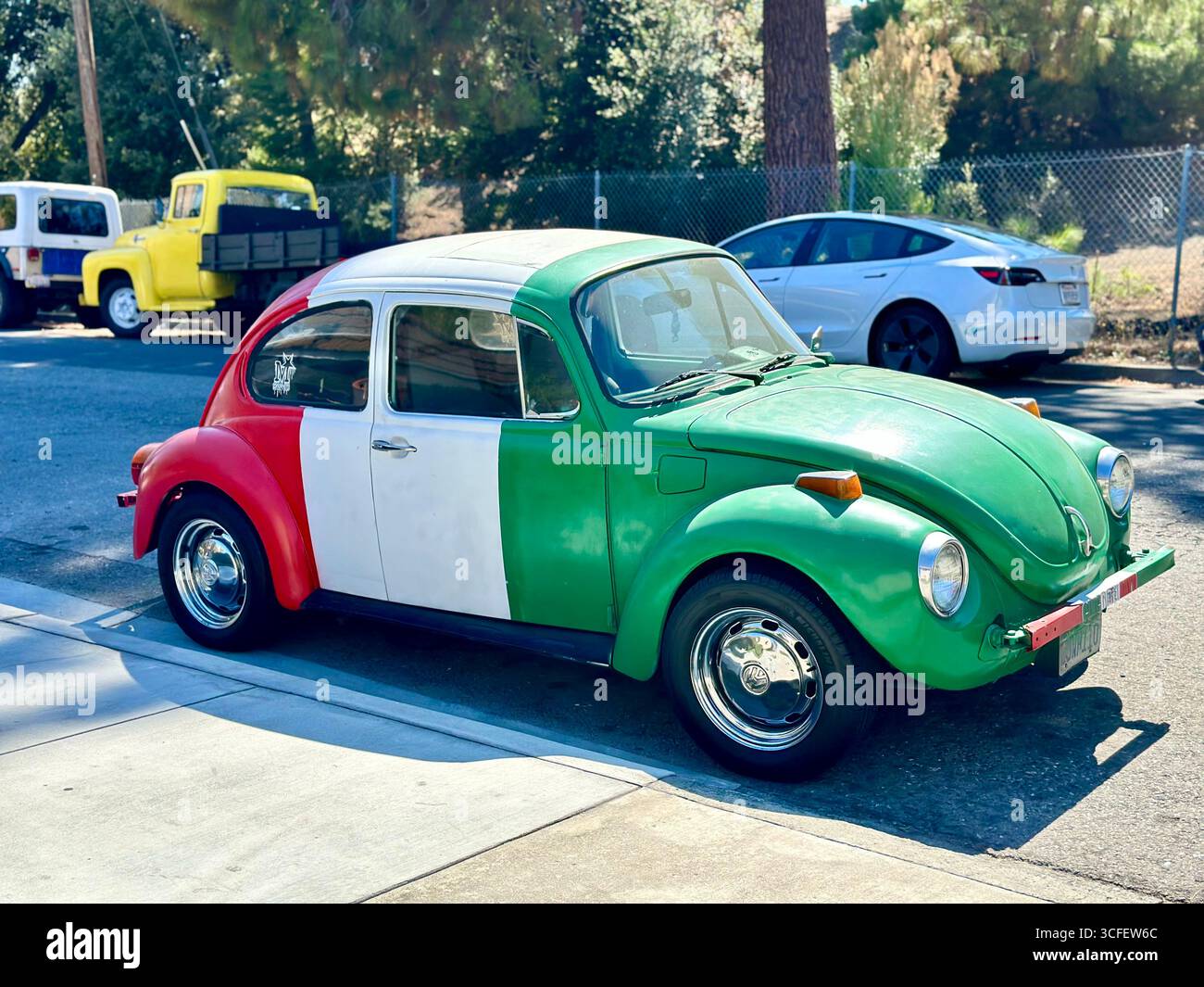 Classic Volkswagen Beetle Painted in Mexican Flag Colors - Smartphone Captured Stock Image