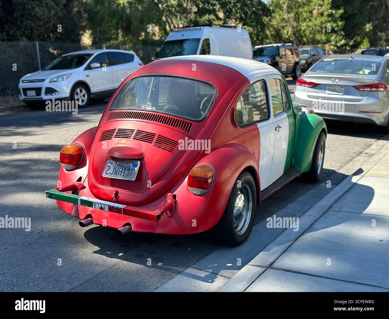 Classic Volkswagen Beetle Painted in Mexican Flag Colors - Smartphone Captured Stock Image