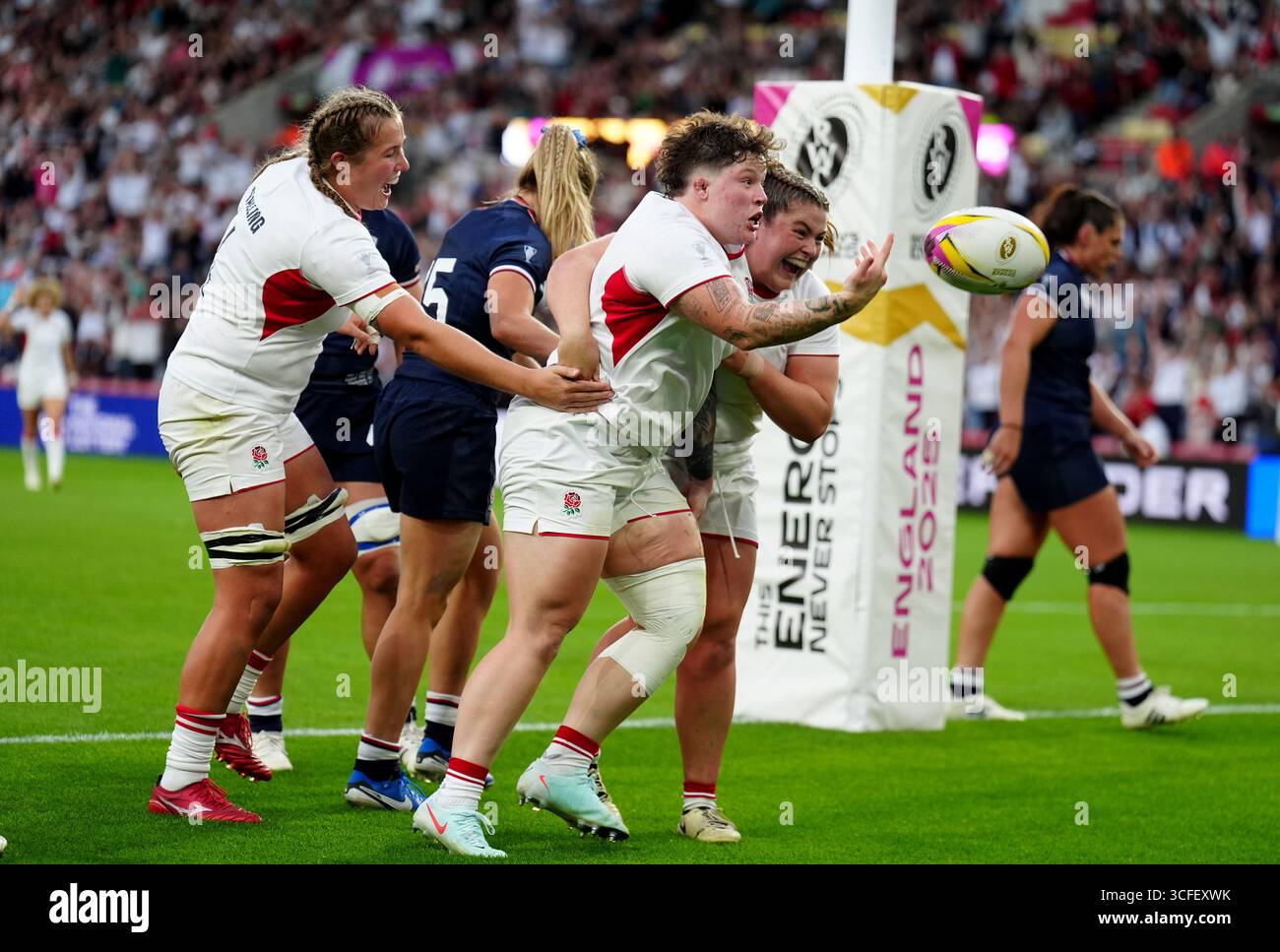 England's Hannah Botterman (centre) celebrates after scoring her sides ...