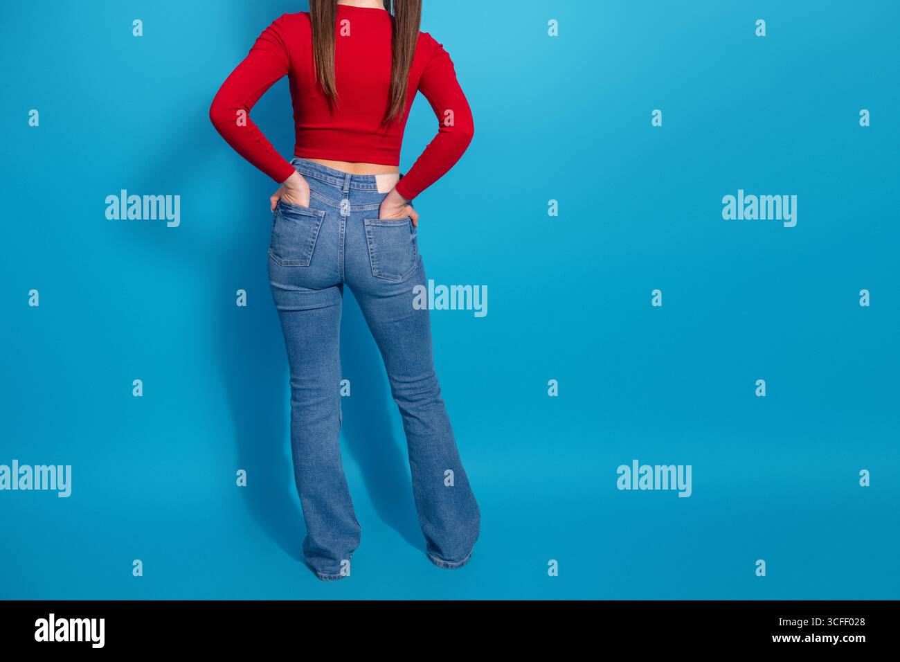 Wearing red top and blue jeans hi-res stock photography and images - Alamy