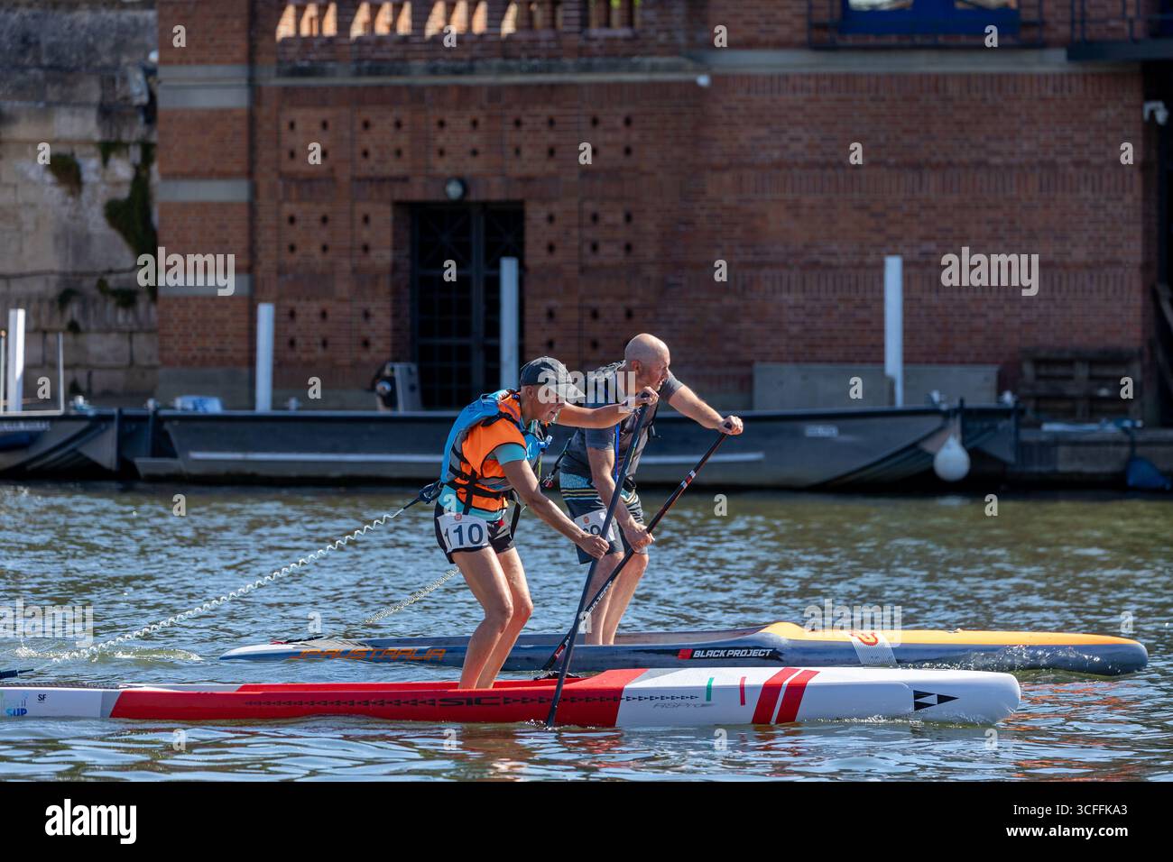 Action photography of Stand Up Paddleboarding (SUP) athletes competing ...