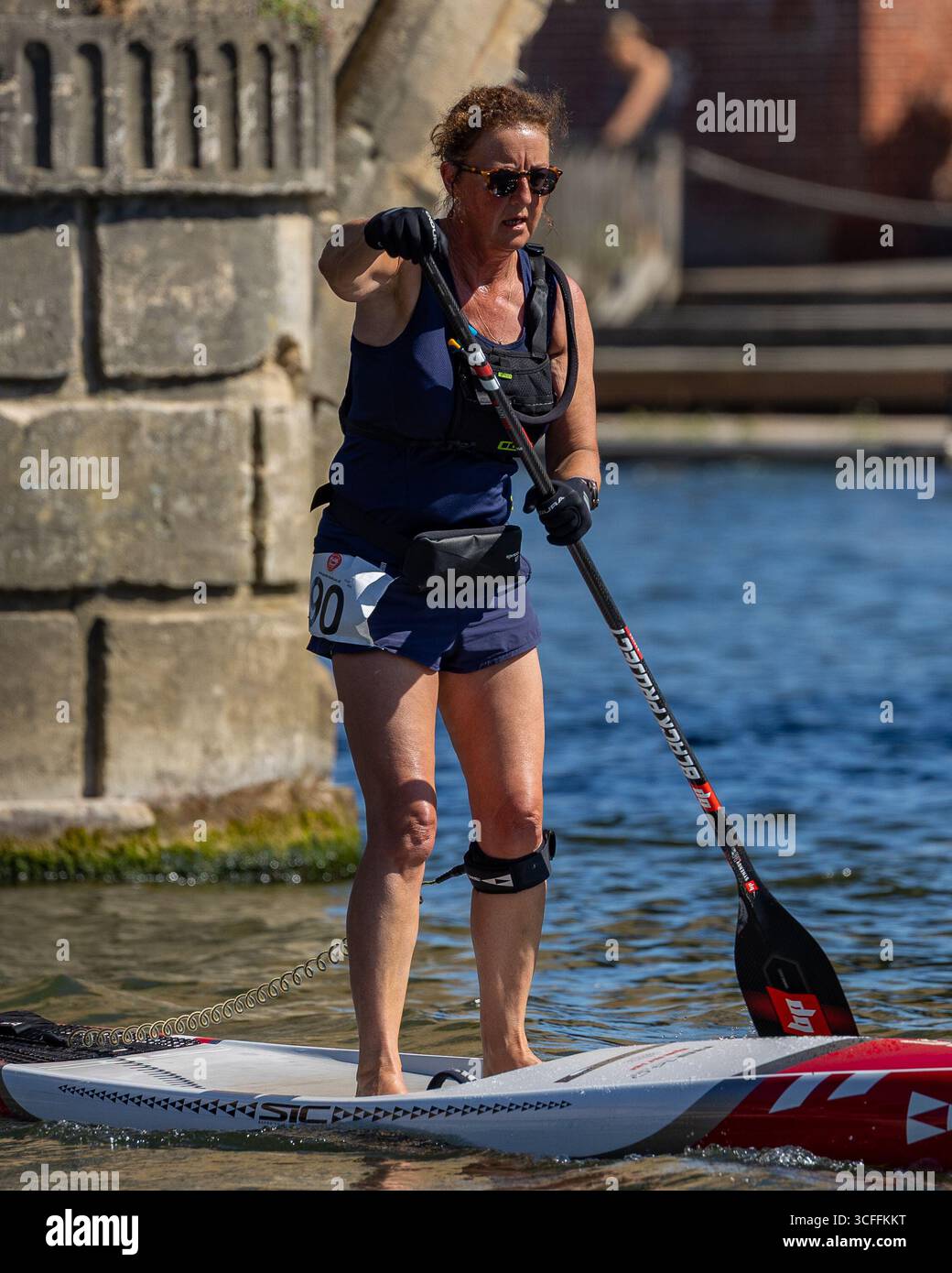 Action photography of Stand Up Paddleboarding (SUP) athletes competing ...