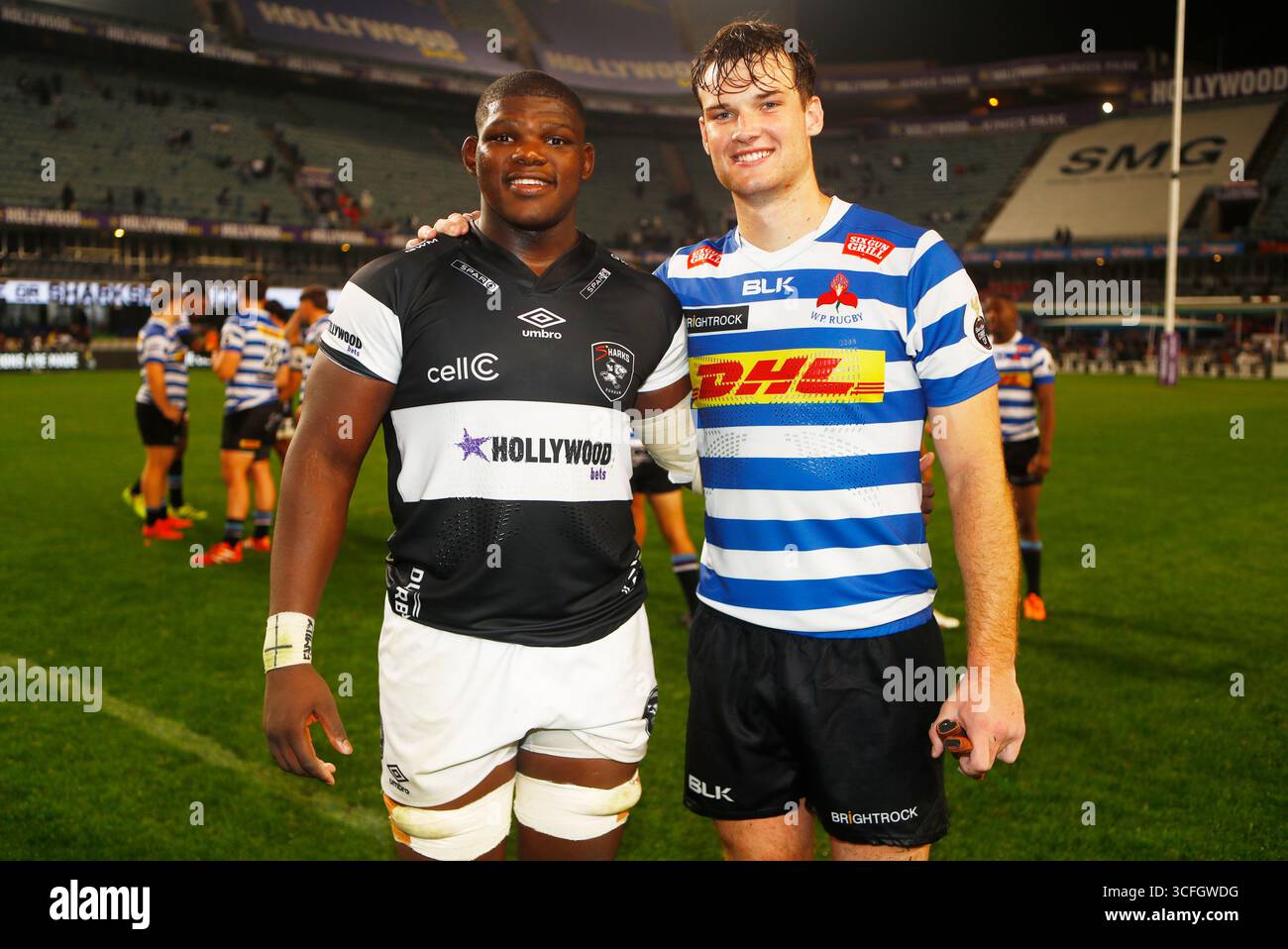 Bathobele Hlekani of the Hollywoodbets Sharks XV with Riley Norton of ...