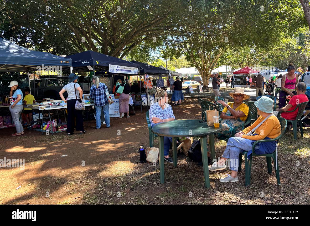 People talking and looking at stalls, Yungaburra Markets, Atherton Tablelands, Queensland, Australia. No MR or PR - Smartphone Captured Stock Image