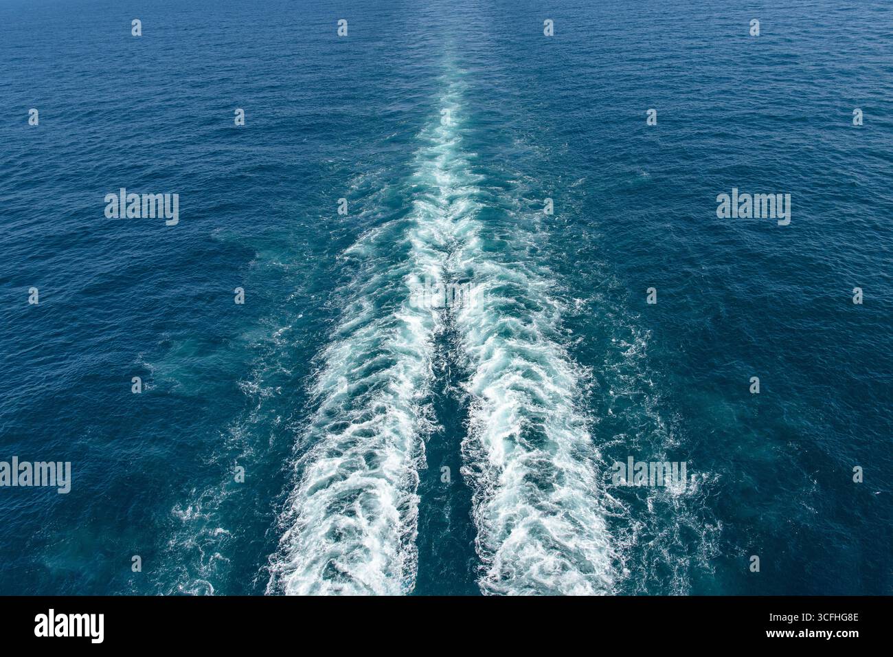 Wake stream from a large twin-screw cruise ship Stock Photo
