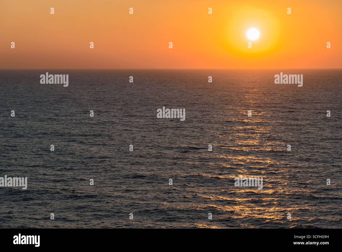 Sunrise in the Strait of Hormuz, off the coast of Iran. The Persian Gulf Stock Photo