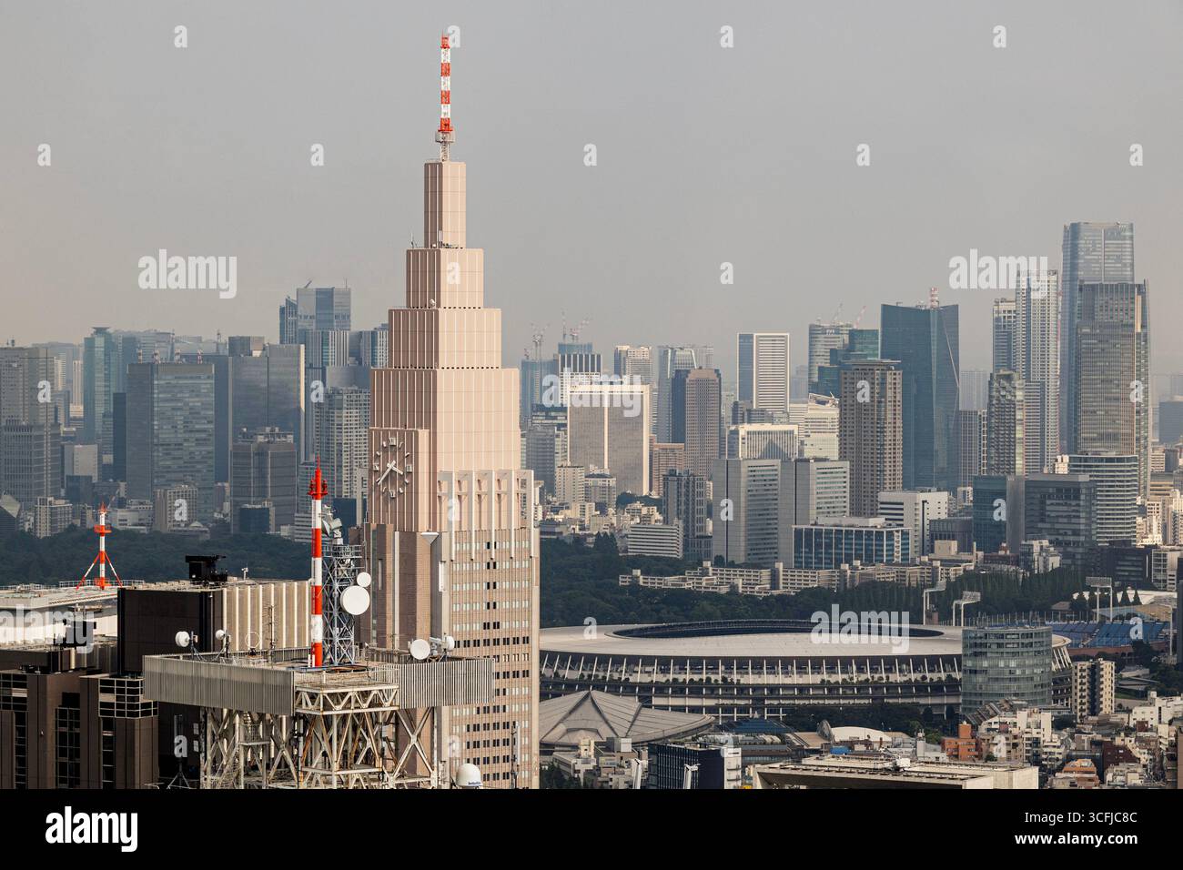 Dodomo Clock tower and the Japan national stadium from the Metropolitan governement building. - Stock Image