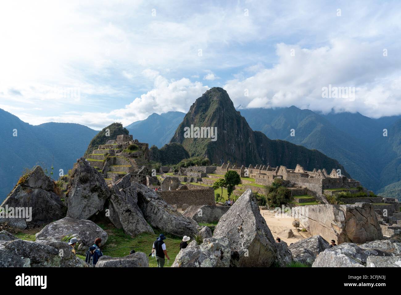 Wide view of Machu Picchu ruins with Huayna Picchu mountain, Inca stone ...