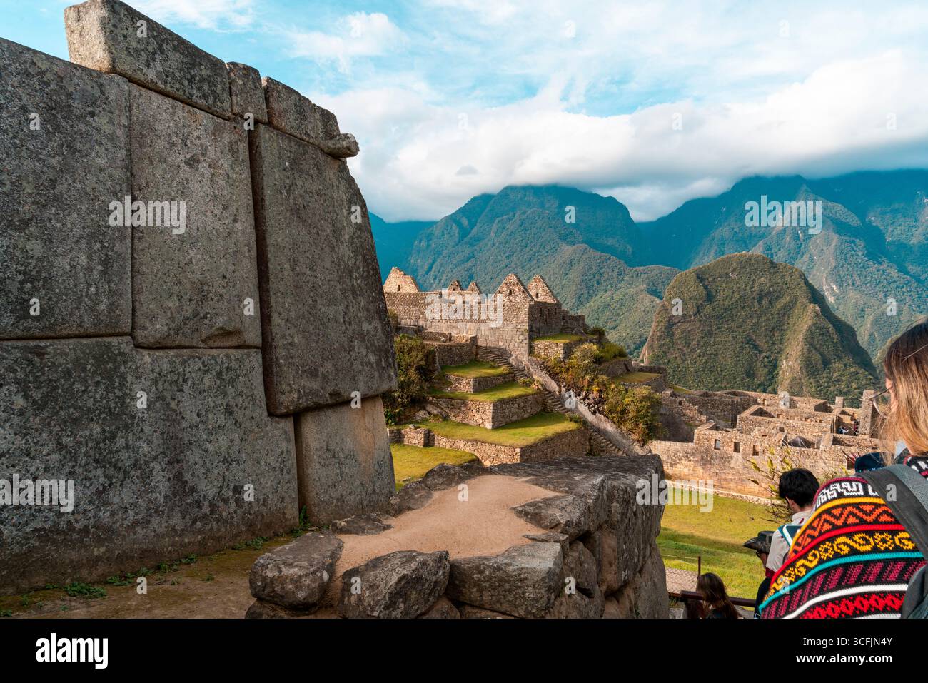 Inca stone terraces and ruins at Machu Picchu with Andes mountains and ...