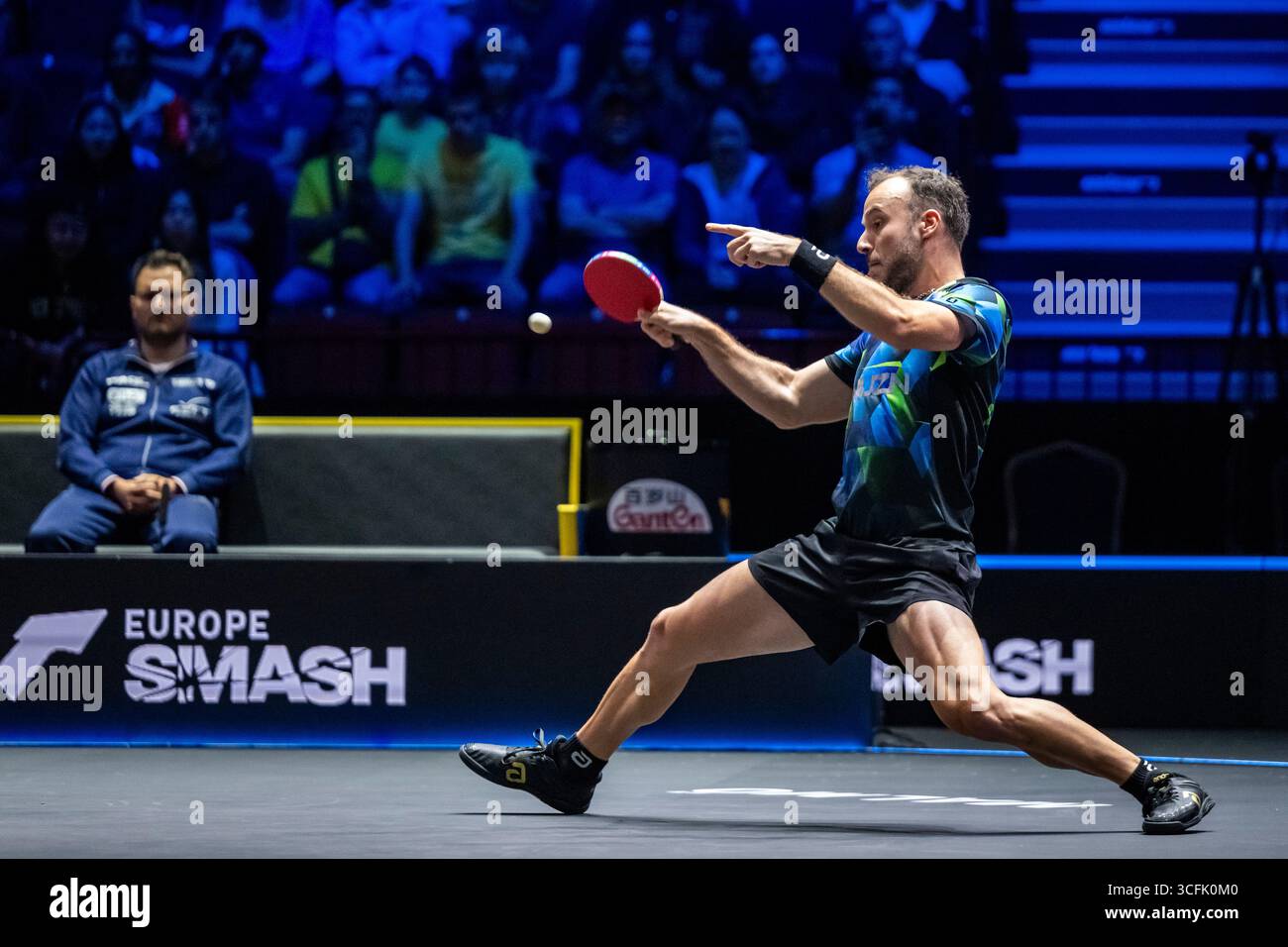 simon-gauzy-of-france-in-action-against-lin-shidong-from-china-in-the