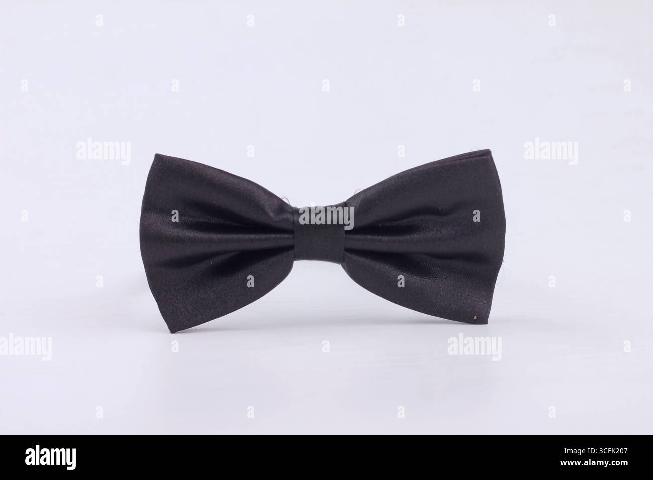 Black bow tie for men isolated on white background. Stock Photo