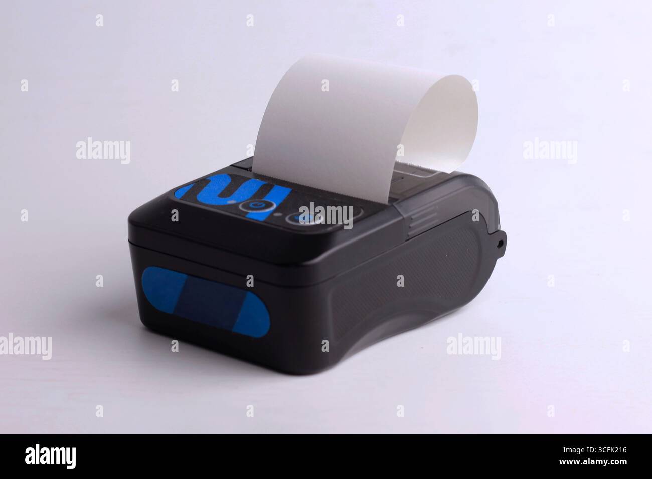 Black receipt printer, mini portable thermal isolated on white background. Stock Photo