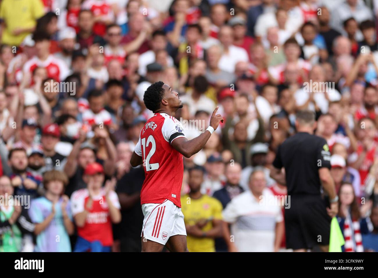 Arsenal's Jurrien Timber celebrates after scoring his side's fourth ...
