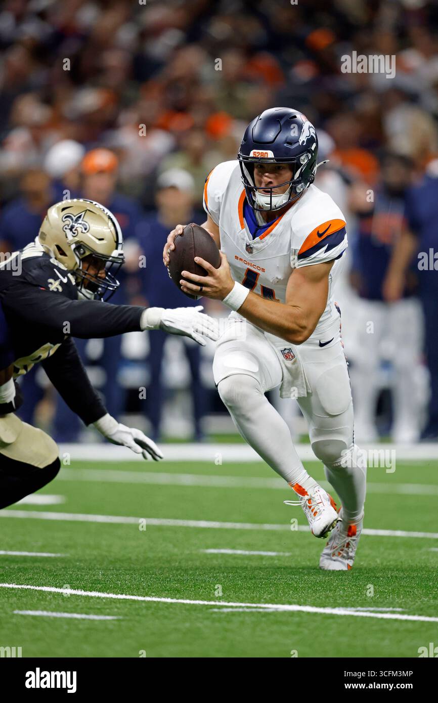 Tyler Ehlinger Denver Broncos quarterback Sam Ehlinger (4) runs past New Orleans ...