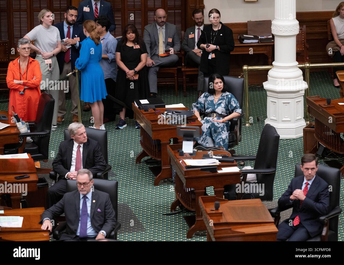 Austin, United States. 23rd Aug, 2025. Texas Sen. CAROL ALVARADO, D-Houston (seated at right) waits to start talking as the Republican-controlled Texas Senate later quashed an early-morning planned Alvarado Democratic filibuster to pass a mid-year redistricting bill that will possibly give Texas five more Republican congressional seats. Credit: Bob Daemmrich/Alamy Live News Stock Photo