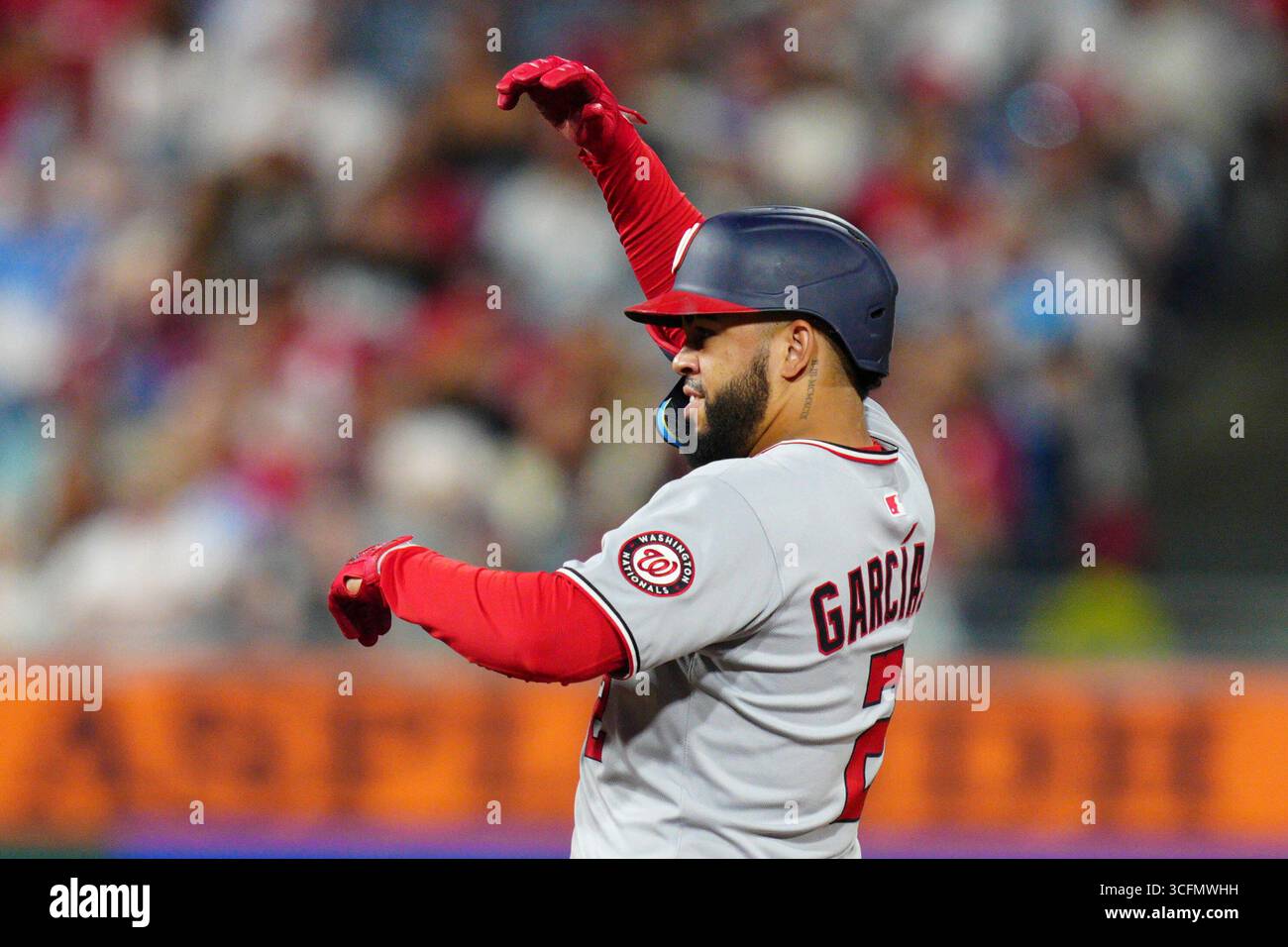 Washington Nationals' Luis García Jr. reacts after hitting an RBI
