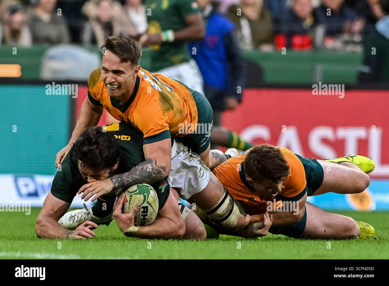 Ruan Nortje of South Africa tackled by Corey Toole of Australia during ...