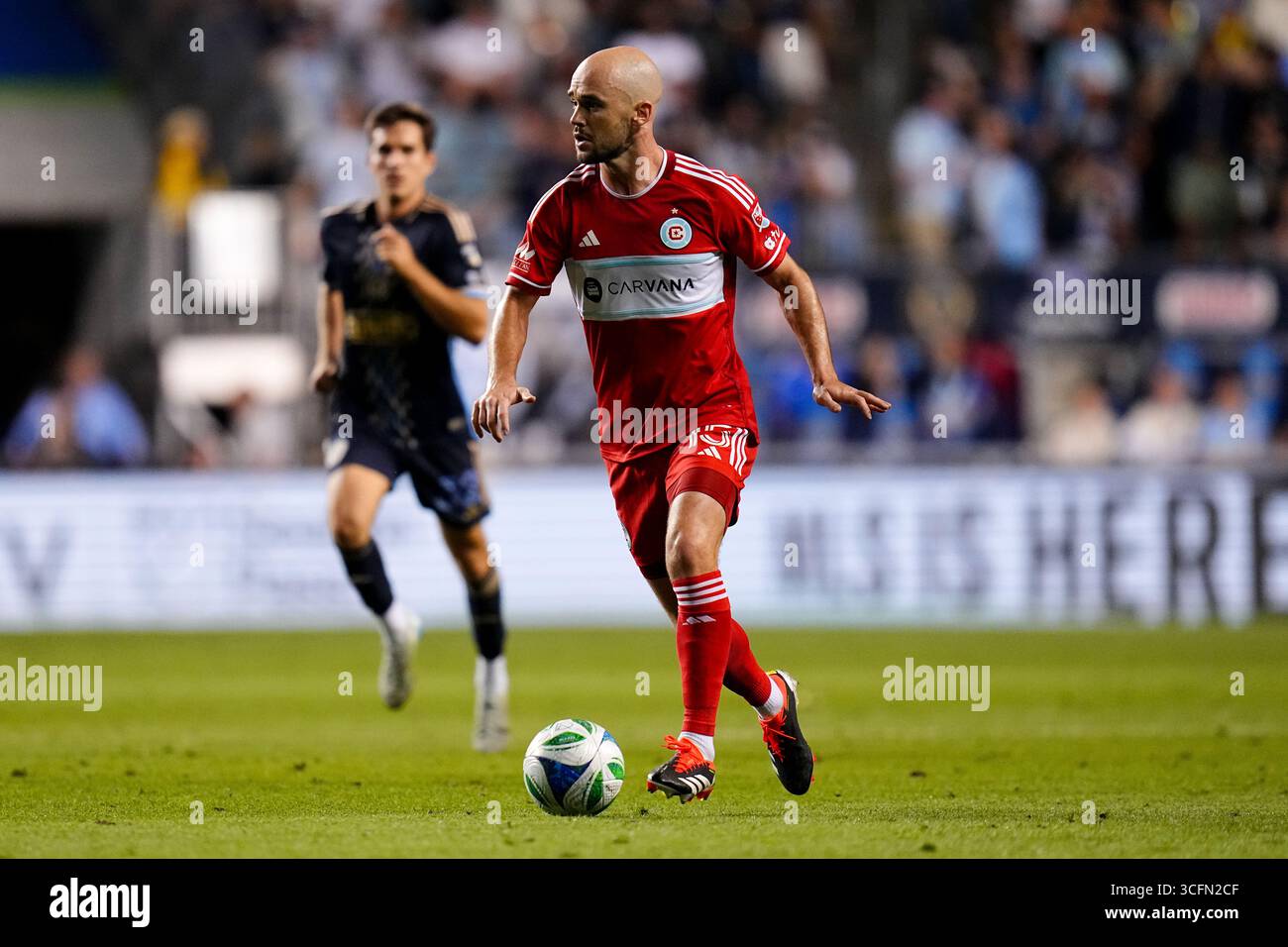 August 23, 2025: Chicago Fire Defender Andrew Gutman (15) controls the ...