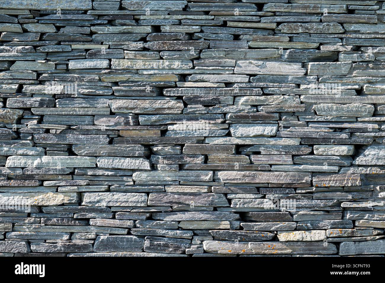 Background from an old natural stone wall Stock Photo