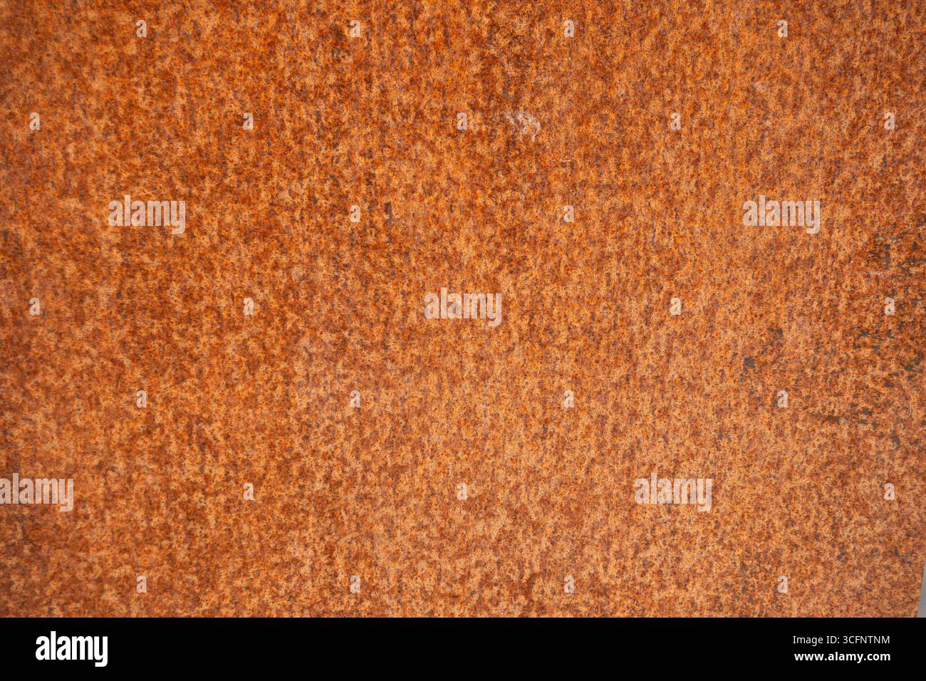 Rusty orange metal surface texture background for industrial or grunge design use Stock Photo