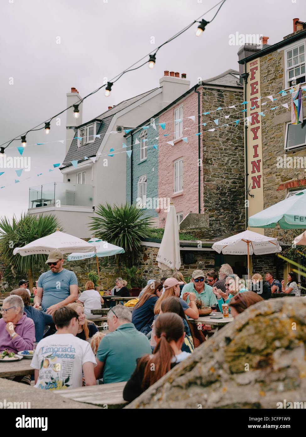 The Ferry Inn and customers in Salcombe Devon England UK Stock Photo