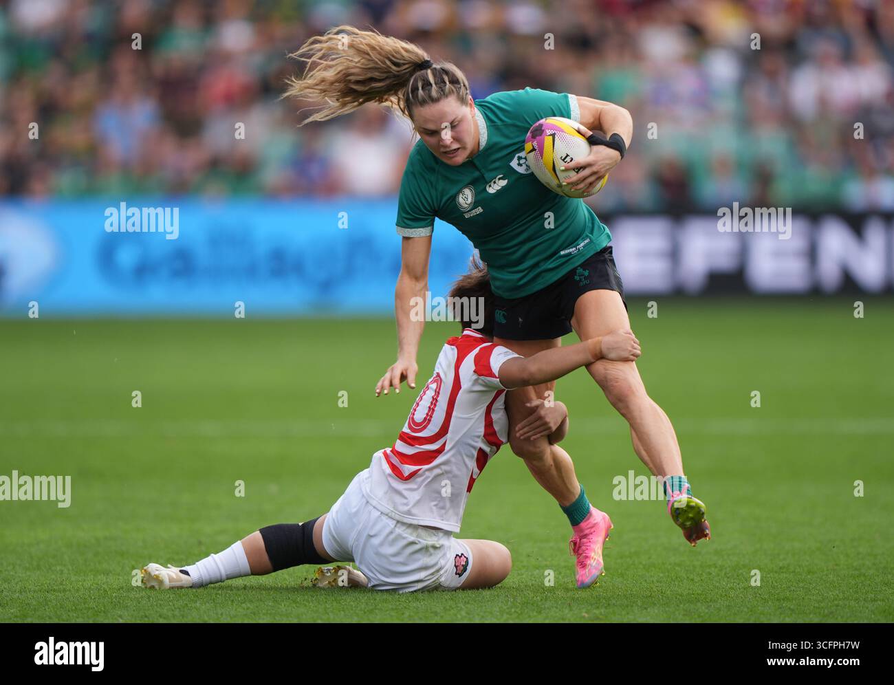 Ireland's Beibhinn Parsons (right) is tackled by Japan's Ayasa Otsuka ...