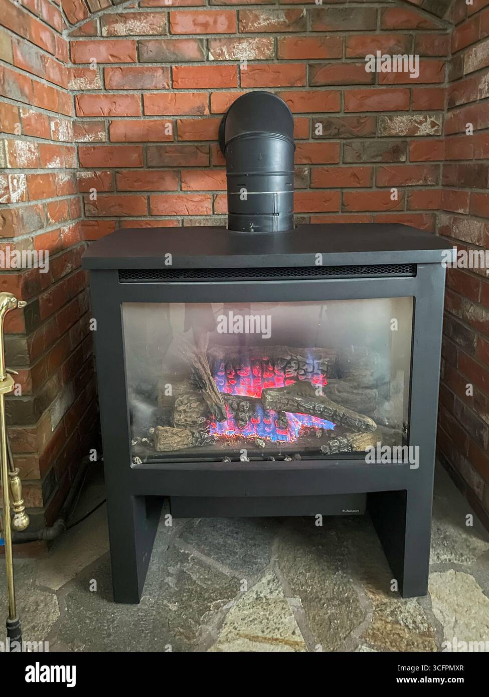 Functional Wood Buring Stove in A Suburban MT  Home, 2025, USA - Smartphone Captured Stock Image