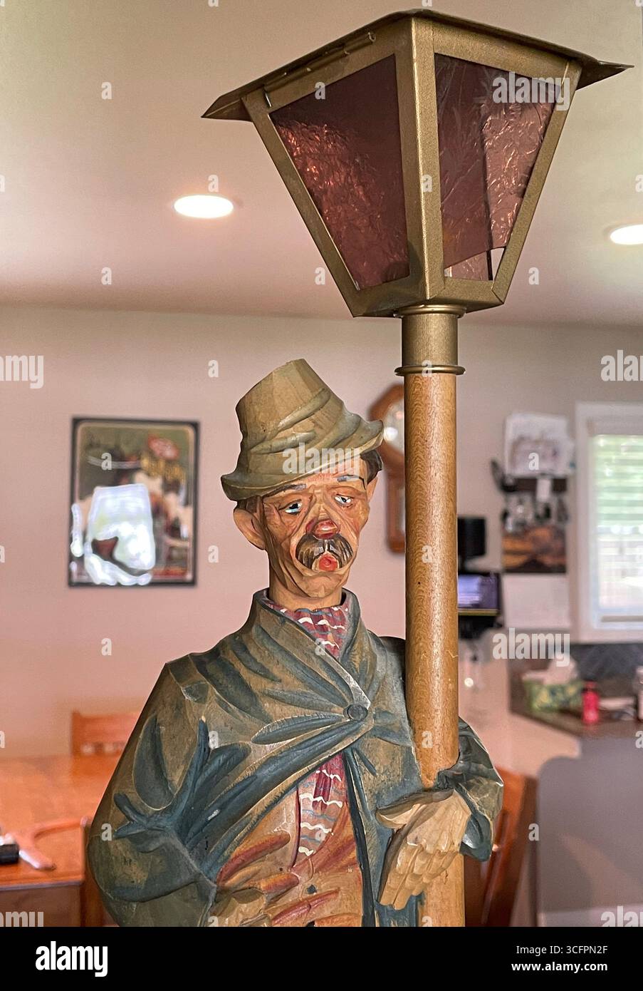 Vintage 1050's Carved German  table lamp , Drunk 'Whistling Man', 1050s - Smartphone Captured Stock Image