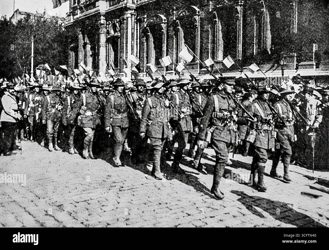 Photograph from L’Illustration (1916) showing Australian soldiers parading before the Prefecture of Marseille, carrying both Union Jack and French flags. The scene marked the arrival of Allied reinforcements and was celebrated by local crowds. This image highlights the role of Australian troops in the First World War and their solidarity with France during the conflict. Stock Photo
