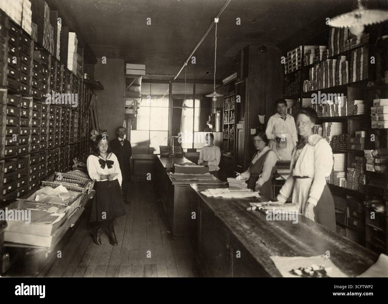 Number of employees/workers in the warehouse of a handicraft factory. Netherlands, Amsterdam, 1918.  Vintage Archive daily life Dutch Photograph, 1910s.   By Kees Hofker Stock Photo