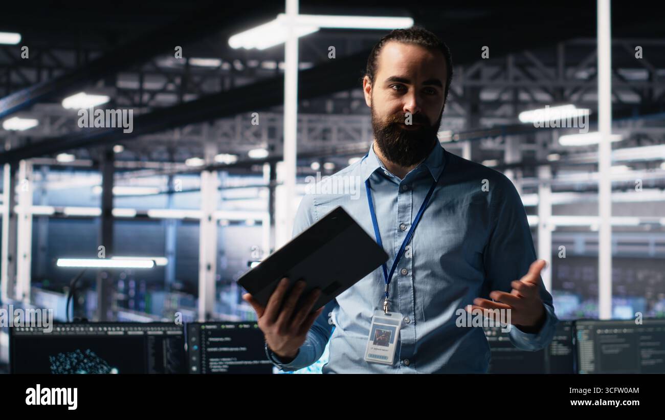 Data center lead programmer showcasing AI technology and rigs, filming ...
