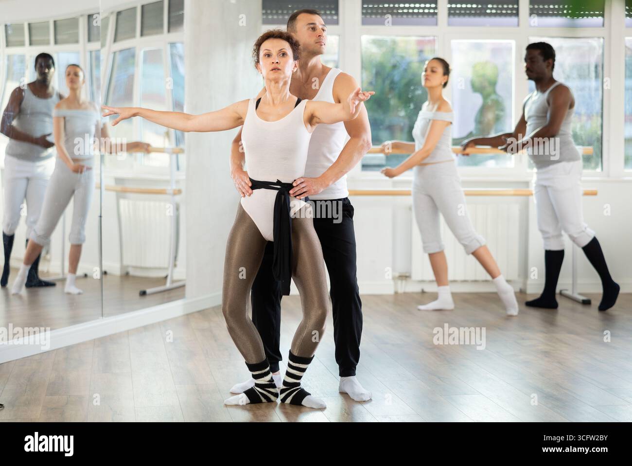 Ballet partners mastering paired technique during group class Stock ...