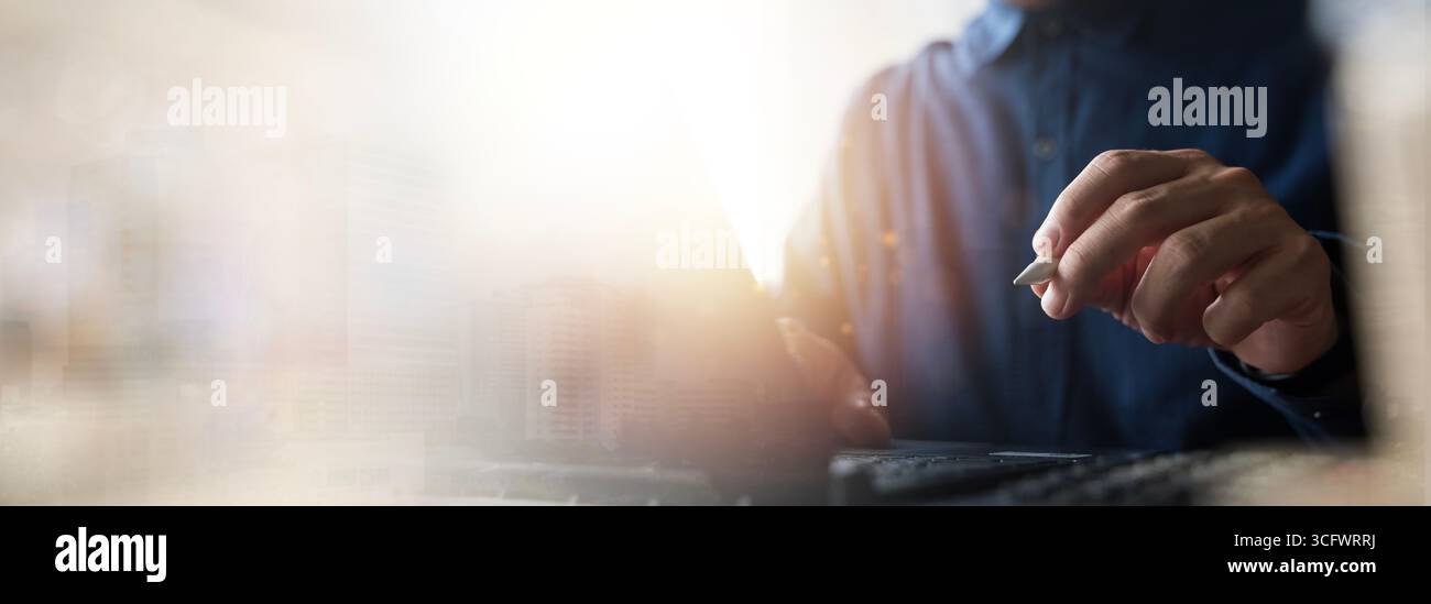 Closeup of businessman hand holding digital pen using laptop for creative design, technology innovation, digital transformation, business management, Stock Photo