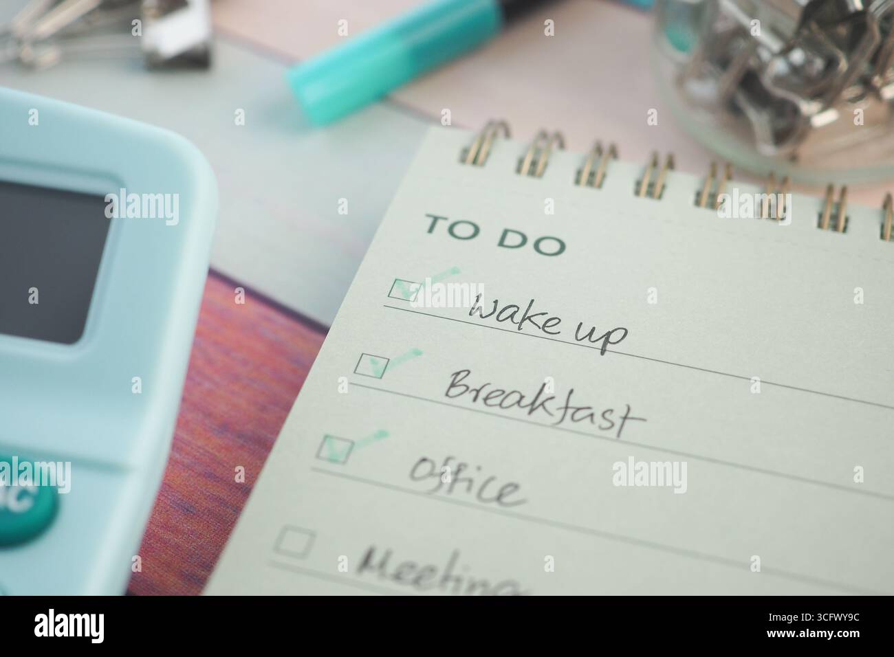 Grocery list and to-do tasks on a workspace notepad Stock Photo