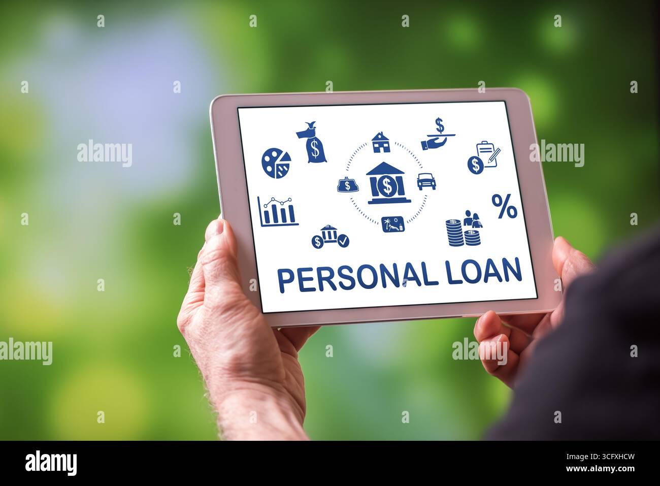 Man holding a tablet showing personal loan concept Stock Photo