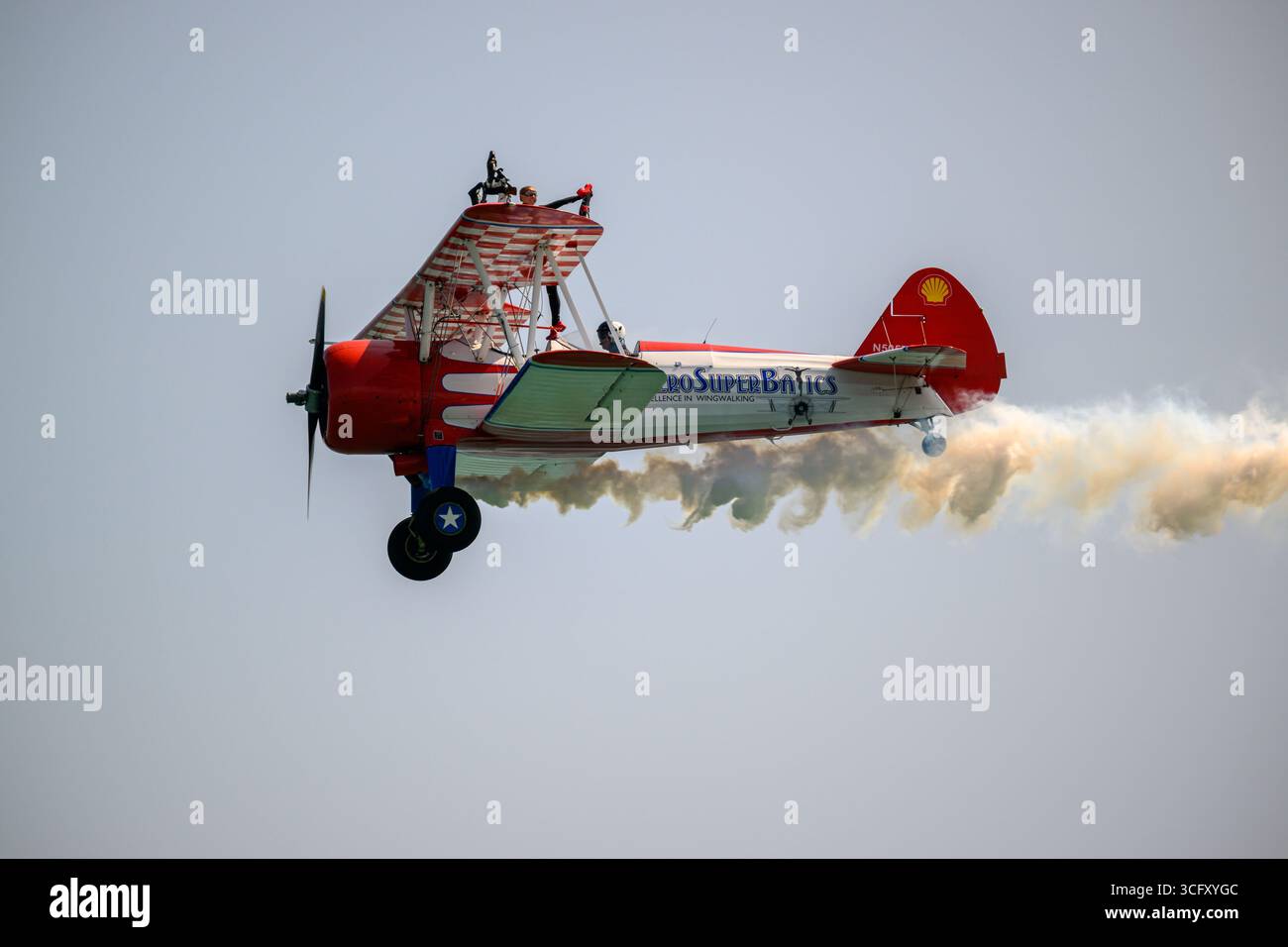 The Aero Super Batics wing walking team flying a Boeing A75N1(PT17) at ...
