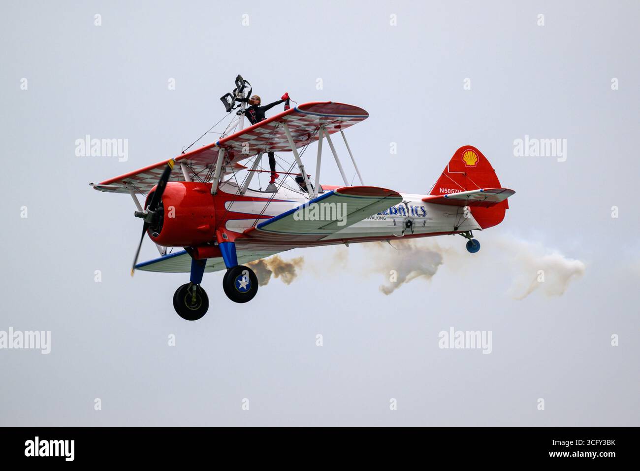 The Aero Super Batics wing walking team flying a Boeing A75N1(PT17) at ...